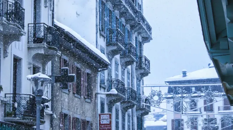 Photo of Chamonix ski resort with snow and people walking