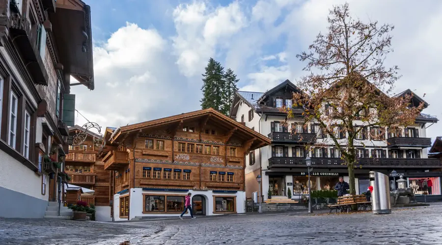Traditional wooden chalets and luxury shops on the Gstaad village promenade